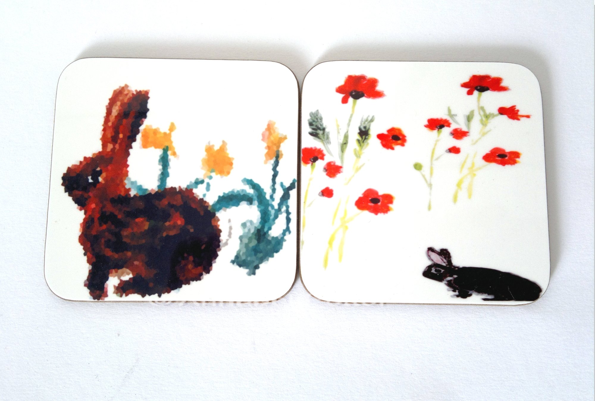 A pair of coasters with rabbits and Daffodils or Poppies