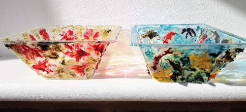 Two recycled plastic pots with abstract paintings