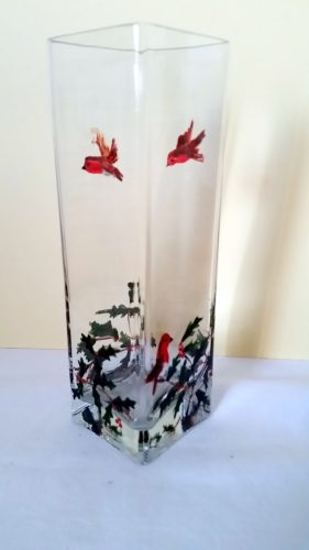 A festive square glass vase hand painted with holly and robins
