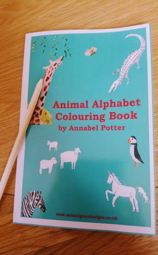 Picture of travel size animal alphabet colouring book with a pencil
